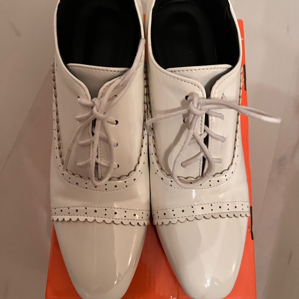 White Patent Leather Flats with Brogue Details